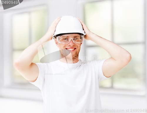 Image of male architect in helmet with safety glasses