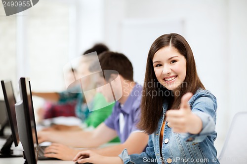 Image of student with computers studying at school
