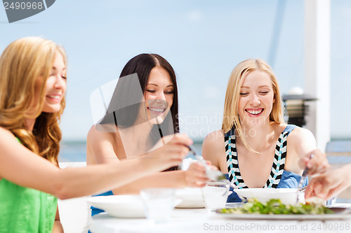 Image of girls in cafe on the beach