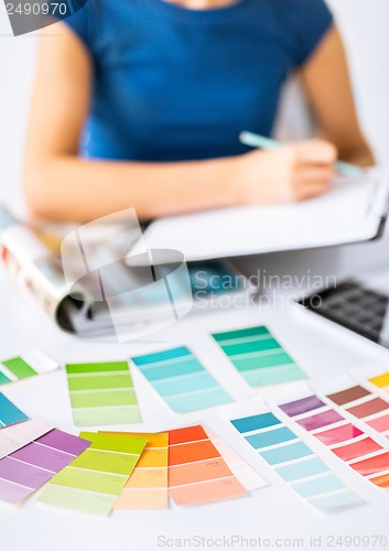 Image of woman working with color samples for selection