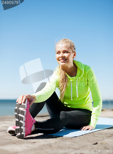 Image of woman doing sports outdoors