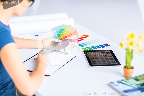 Image of woman working with color samples for selection