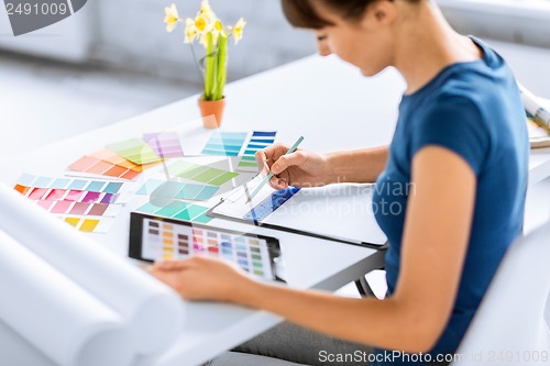 Image of woman working with color samples for selection