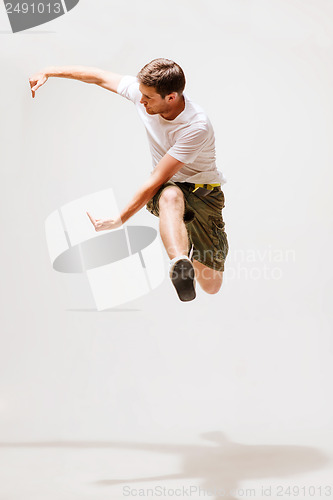 Image of male dancer jumping in the air