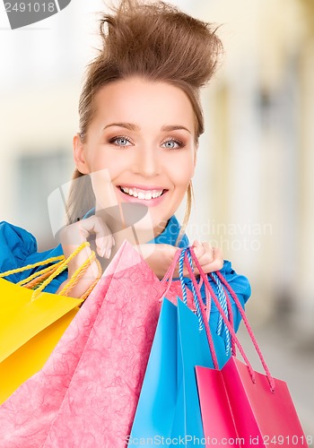 Image of woman with shopping bags in ctiy