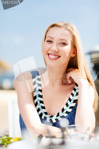 Image of girl in cafe on the beach