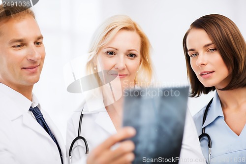 Image of doctors looking at x-ray
