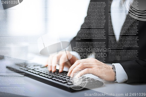 Image of man hands typing on keyboard