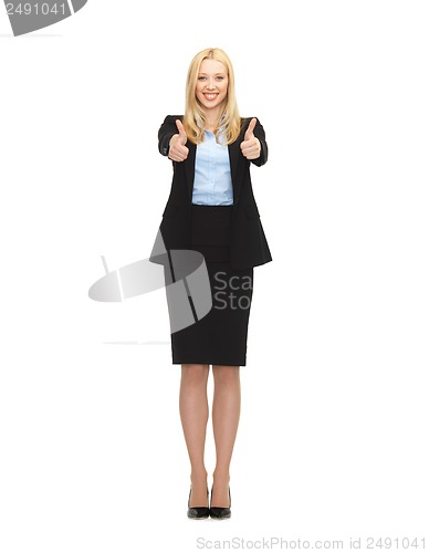 Image of young businesswoman with thumbs up