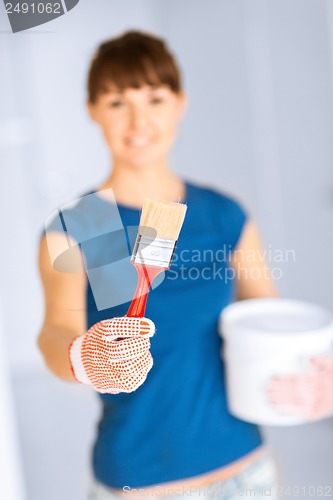 Image of woman with paintbrush and paint pot