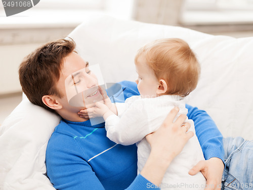 Image of happy father with adorable baby