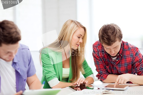 Image of students browsing in tablet pc at school