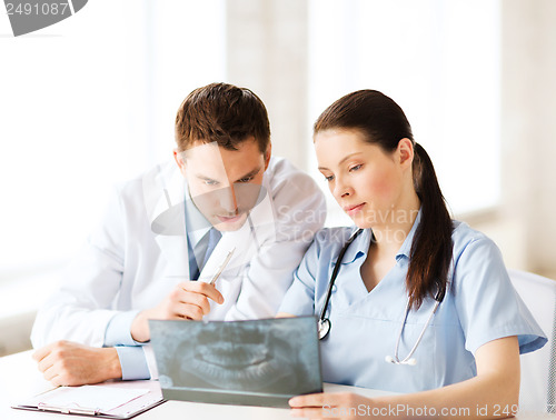 Image of two doctors looking at x-ray