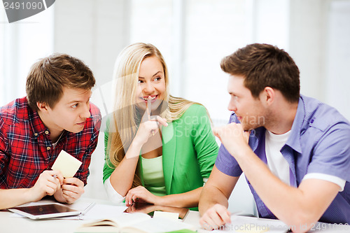 Image of group of students gossiping at school