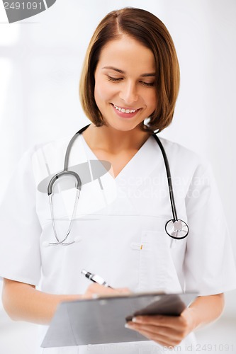 Image of female doctor with stethoscope and clipboard