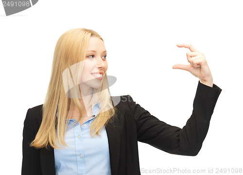 Image of businesswoman holding something imaginary