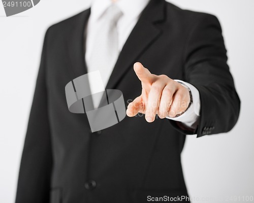 Image of man hand pointing at something