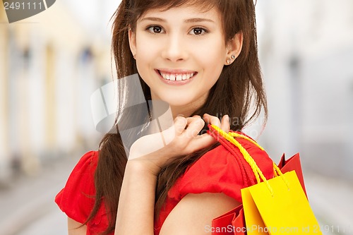 Image of woman with shopping bags in ctiy