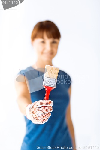 Image of woman with paintbrush