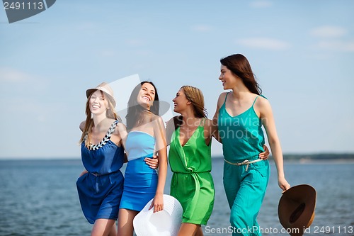 Image of girls walking on the beach