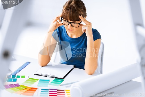 Image of stressed interior designer