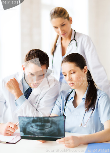 Image of group of doctors looking at x-ray