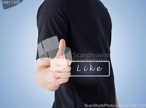 Image of man showing thumbs up