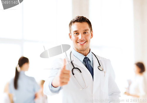 Image of doctor with stethoscope showing thumbs up