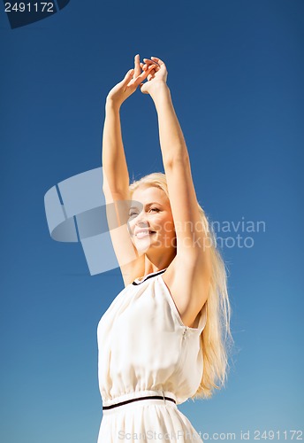 Image of beautiful woman enjoying summer outdoors