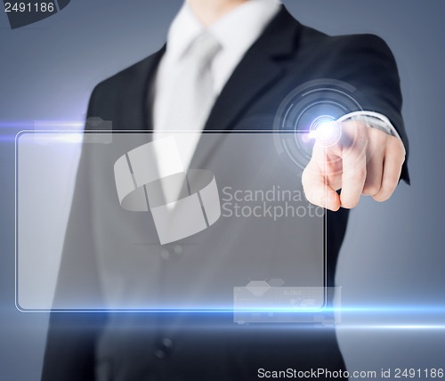 Image of male hand touching virtual screen