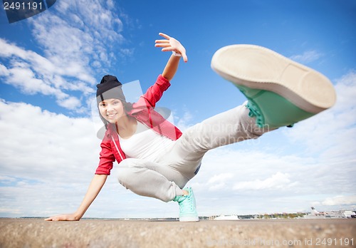 Image of beautiful dancing girl in movement