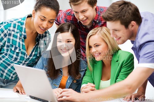 Image of students looking at tablet pc in lecture at school