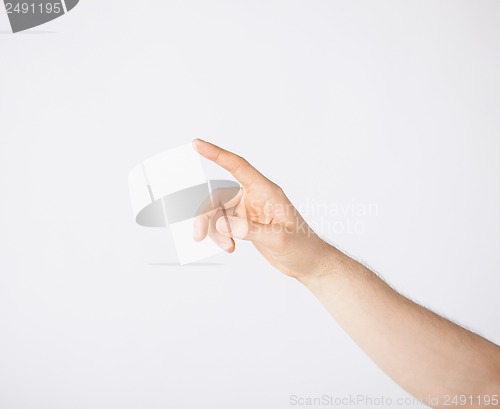 Image of man hand pointing at something