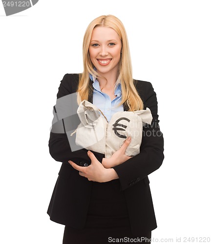 Image of businesswoman holding money bags with euro