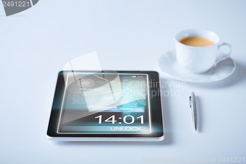 Image of tablet pc and cup of coffee