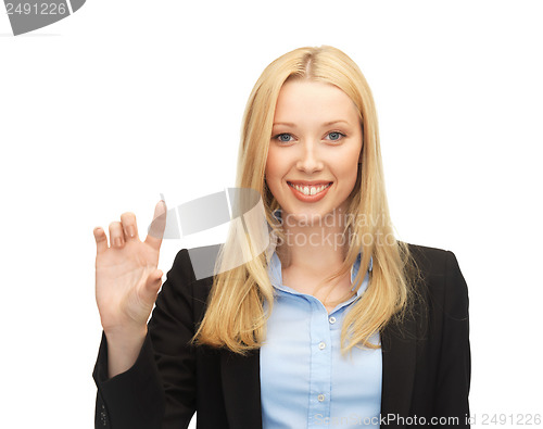 Image of businesswoman holding something imaginary