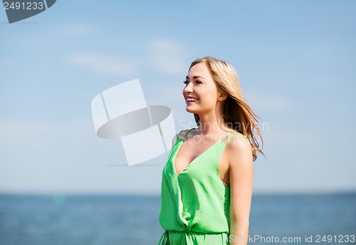 Image of girl standing on the beach