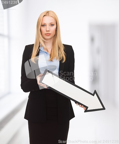 Image of businesswoman with direction arrow sign