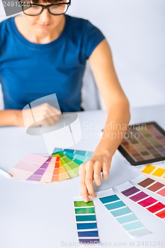 Image of woman working with color samples for selection