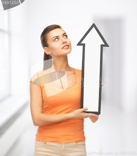 Image of smiling woman with direction arrow sign