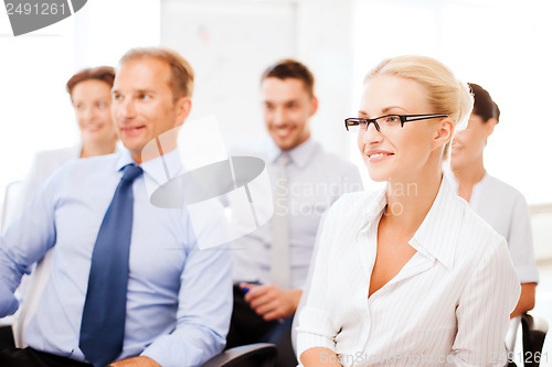 Image of businessmen and businesswomen on conference