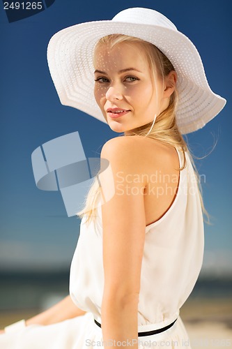 Image of beautiful woman enjoying summer outdoors