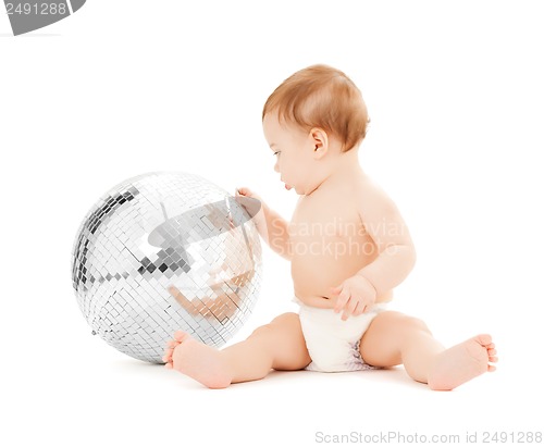 Image of child playing with disco ball