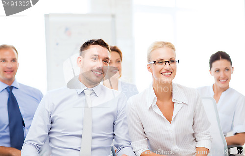 Image of businessmen and businesswomen on conference