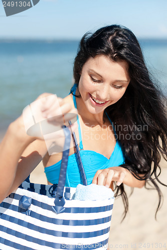 Image of girl sunbathing on the beach
