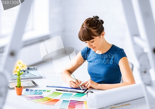 Image of woman working with color samples for selection