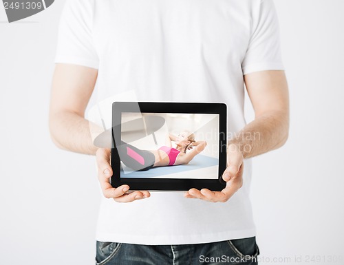 Image of man with tablet pc and sporty woman
