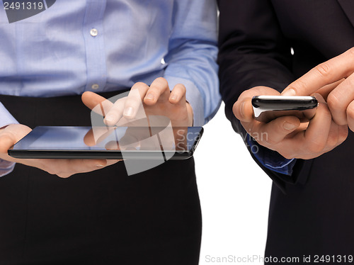 Image of hands with smartphones and tablet pc