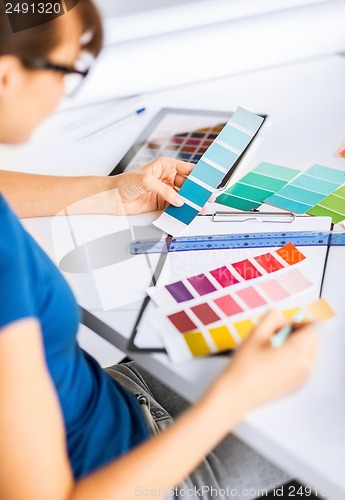 Image of woman working with color samples for selection