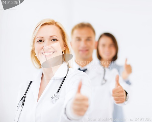 Image of team of doctors showing thumbs up